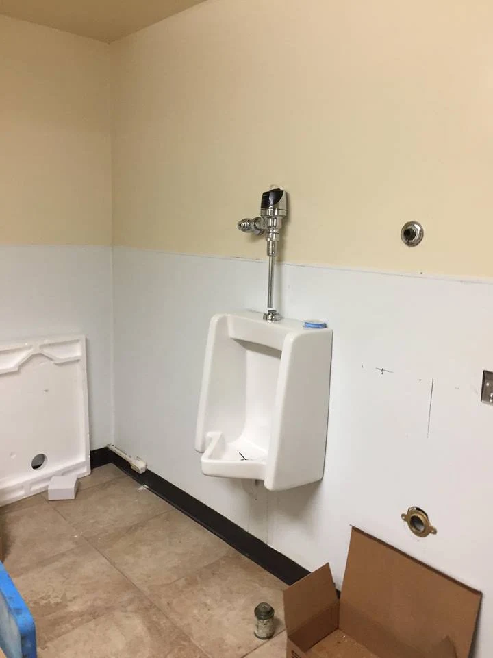 Commercial restroom plumbing fixture repair by Advanced Home Repairs LLC